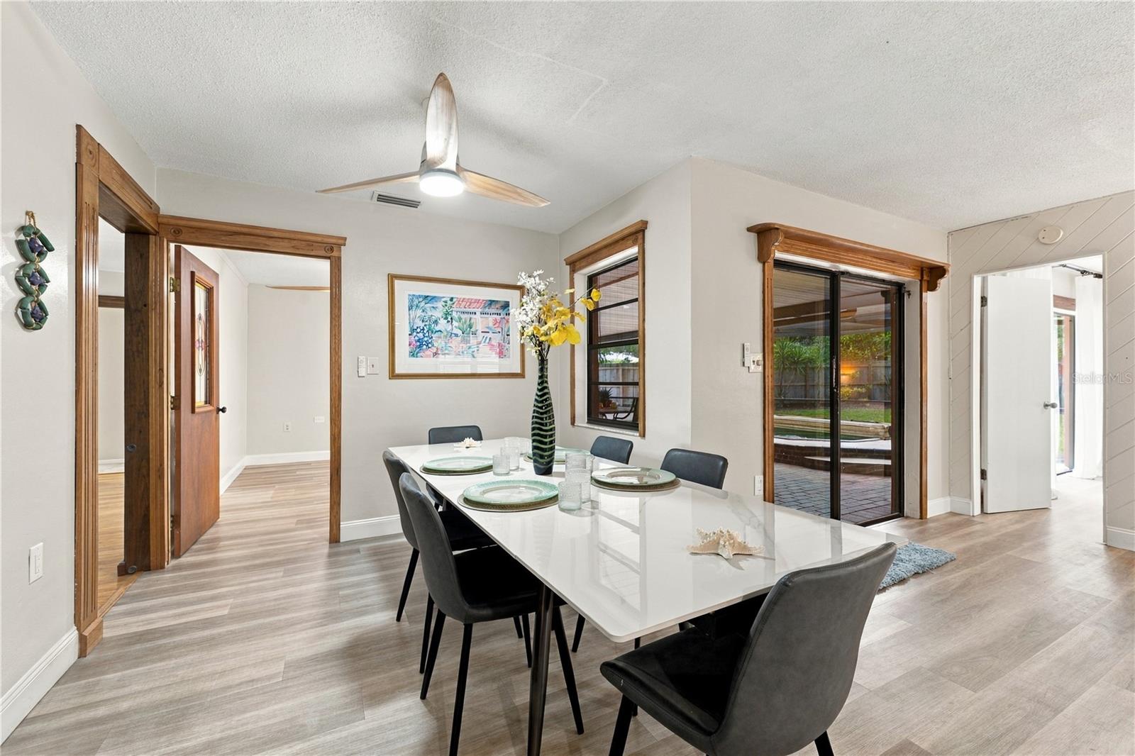 48. Dining Area (12.8 x 9.1) Leads into Bonus Room/Den .. Receives Loads of Light.. & Part of the Great Room... w Kitchen/Family Rooms!