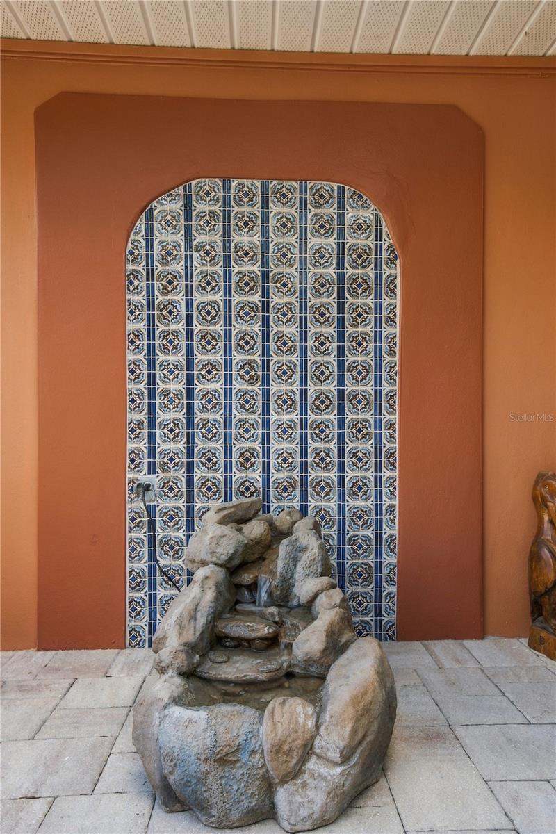 41b. Arch Tile Detail Adds an Exotic Elegance to the Courtyard Entry... The Trickling Fountain is the Cherry on Top!