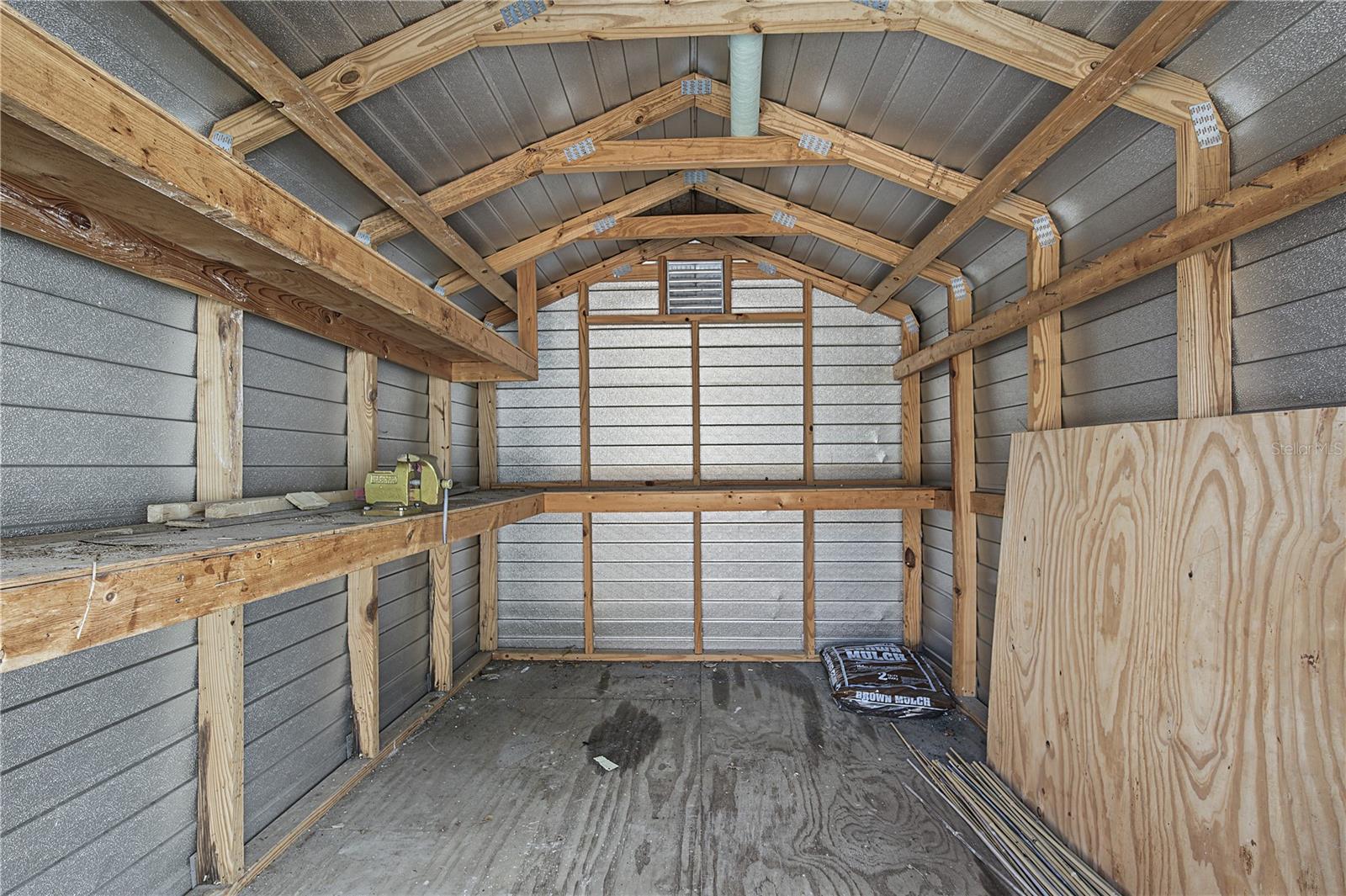 39. Elevated Full Size METAL Shed Rests on an Extended Concrete Pad.. HIGH & DRY for Your Storage Needs! Built/Installed to LAST!