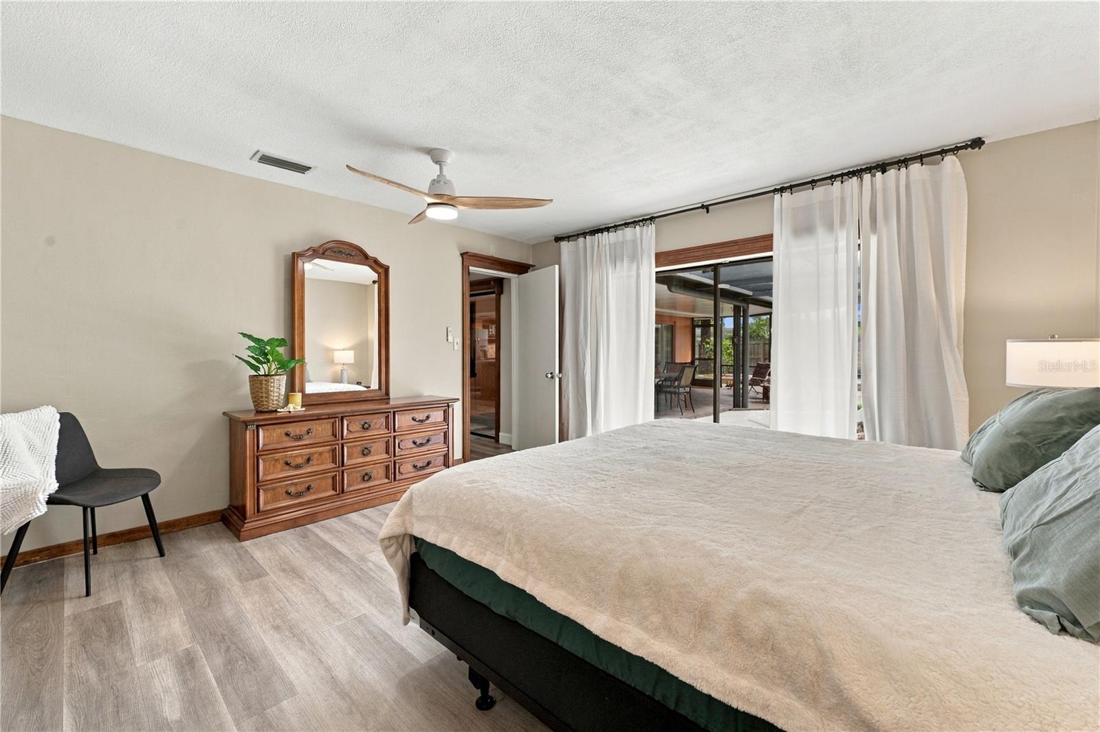 58. Owner's Retreat (14.1 x 14.5') Features Oversized Sliders to Lanai.. View of Hot Tub too..