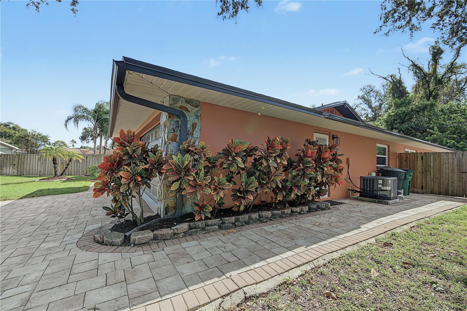 40. Extra Wide Paver Sidewalk Wraps Around the Corner to the Garage Entry & Leads to Backyard Fence Gate!