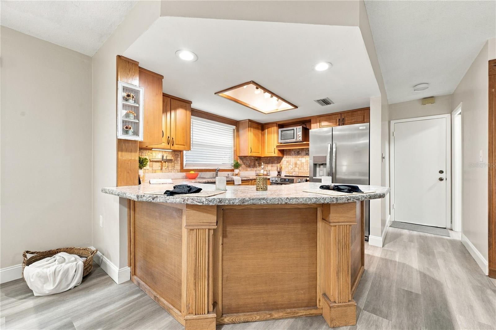 49. Updated Kitchen (9.4 x 12.2') w Durable Attractive Laminate Counters, New Recessed Lights, Plenty of Counterspace..