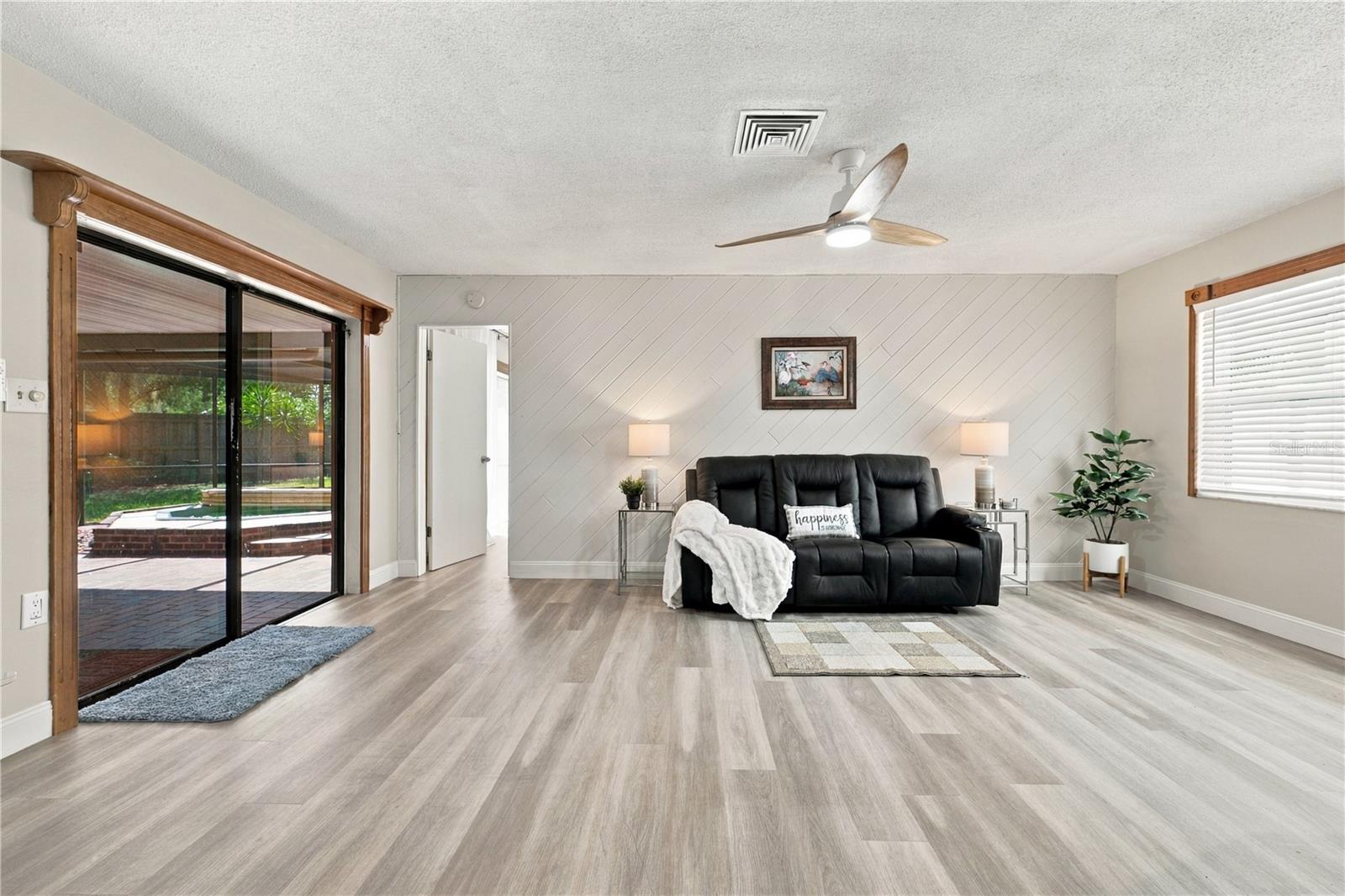 20. Family Room (10.10 x 18.9') Features a Wood Accent Wall.. Great Light, a Part of the Great Room!