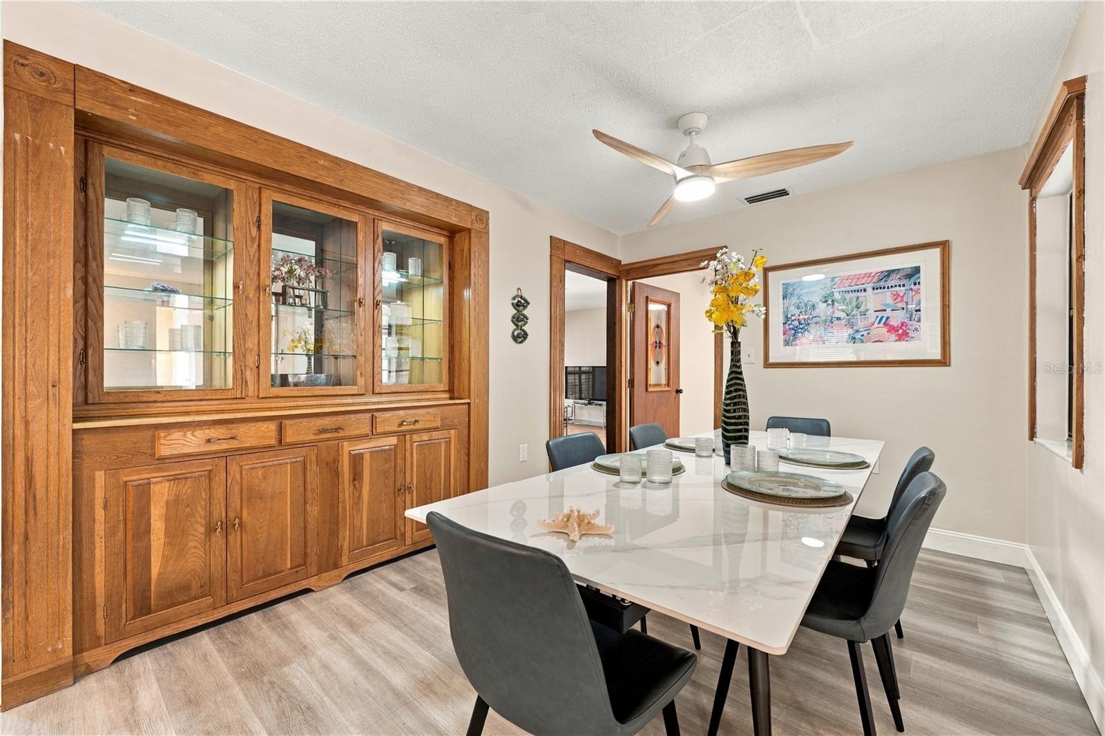 18. Dining Area (12.8 x 9') Has a Gorgeous Solid Wood Custom Built In Hutch for Your Dinnerware..