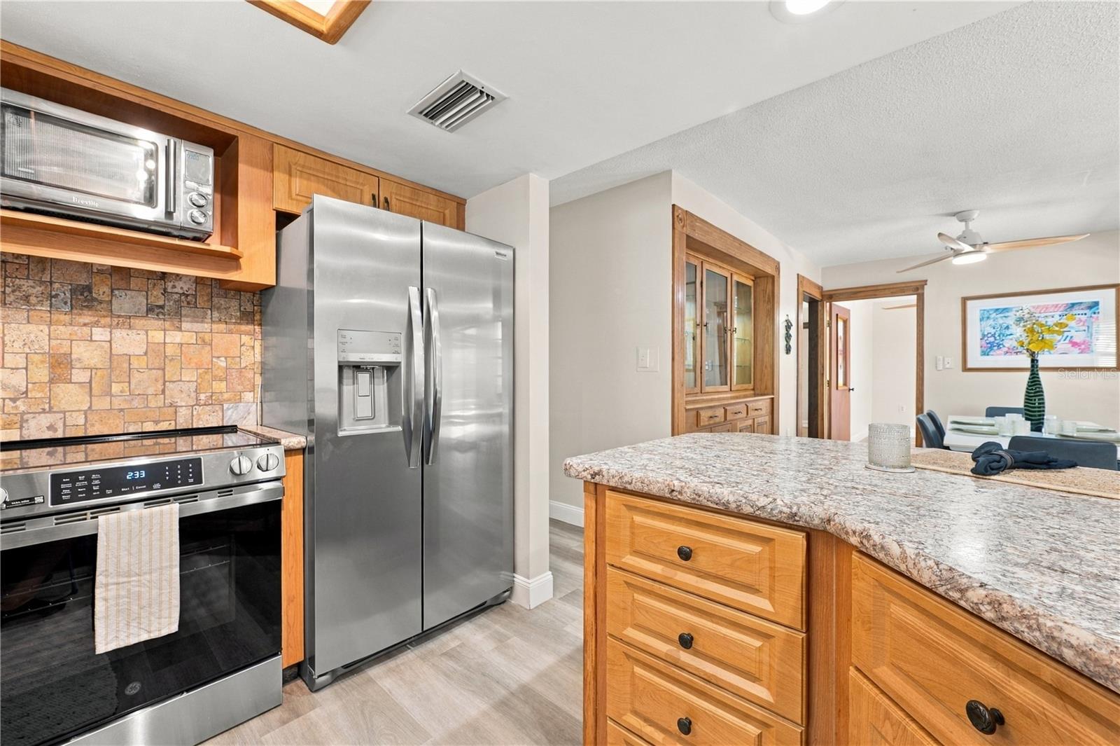 16a. Kitchen (9.4 x 12.2') Features NEW Stainless Steel Appliances! Convection/Air Fry Range!! French Door Counter Depth Fridge too!!