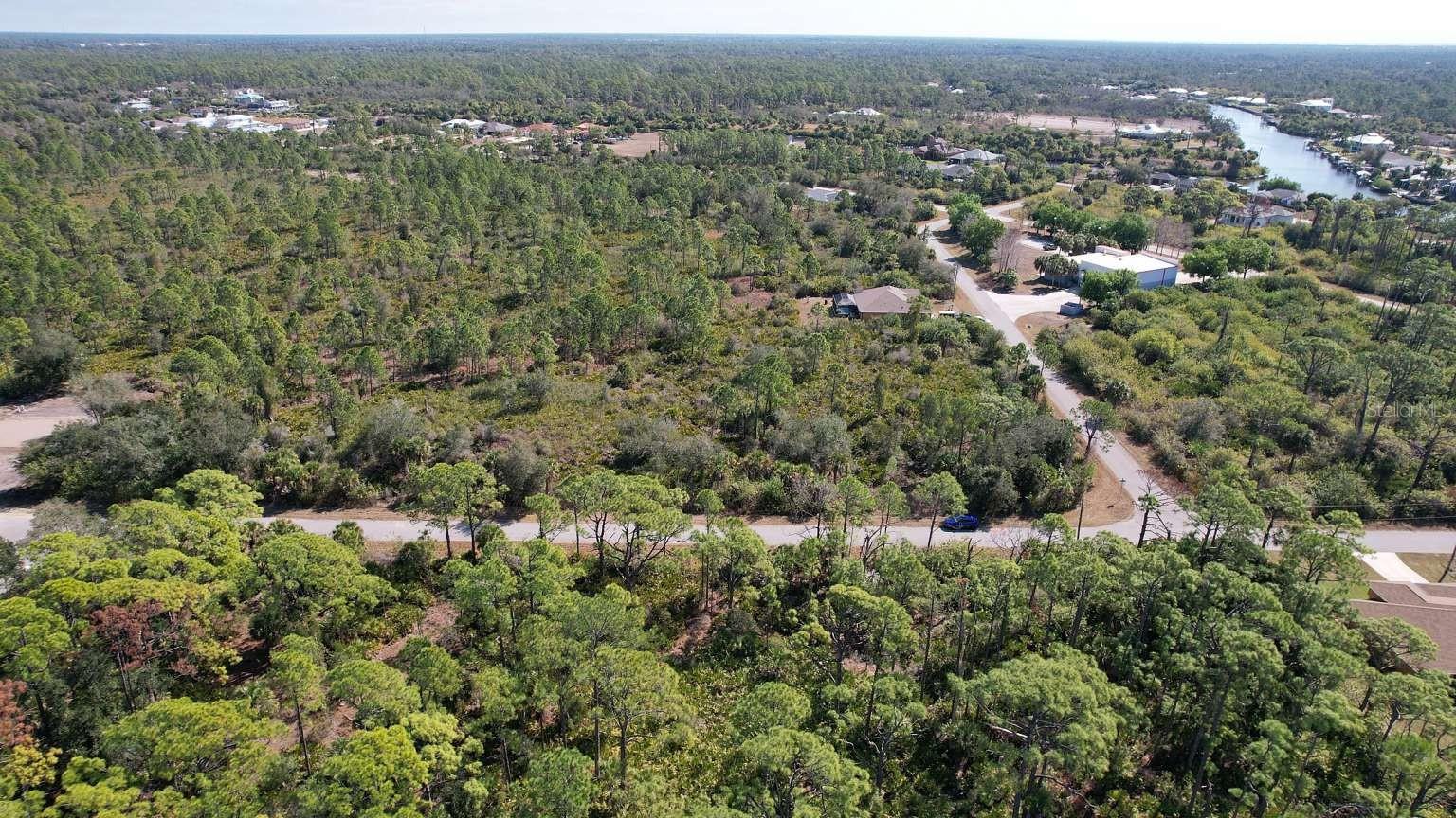 Aerial view of surrounding area; nearby water is not part of the property. Aerial view of surrounding area; nearby water is not part of the property.