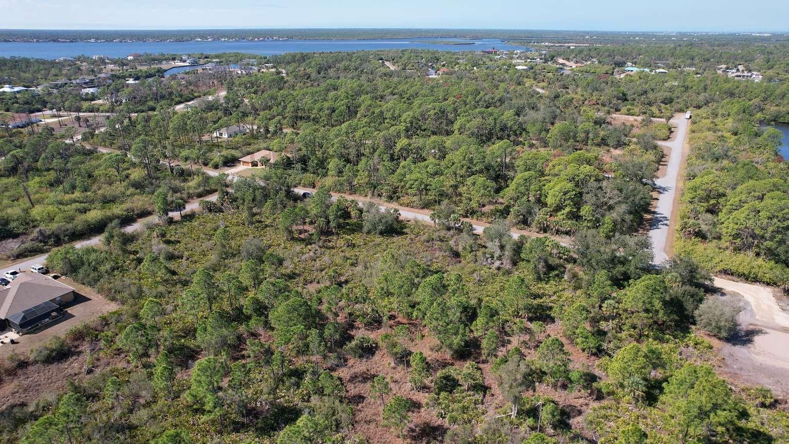 Aerial view of surrounding area; nearby water is not part of the property. Aerial view of surrounding area; nearby water is not part of the property.