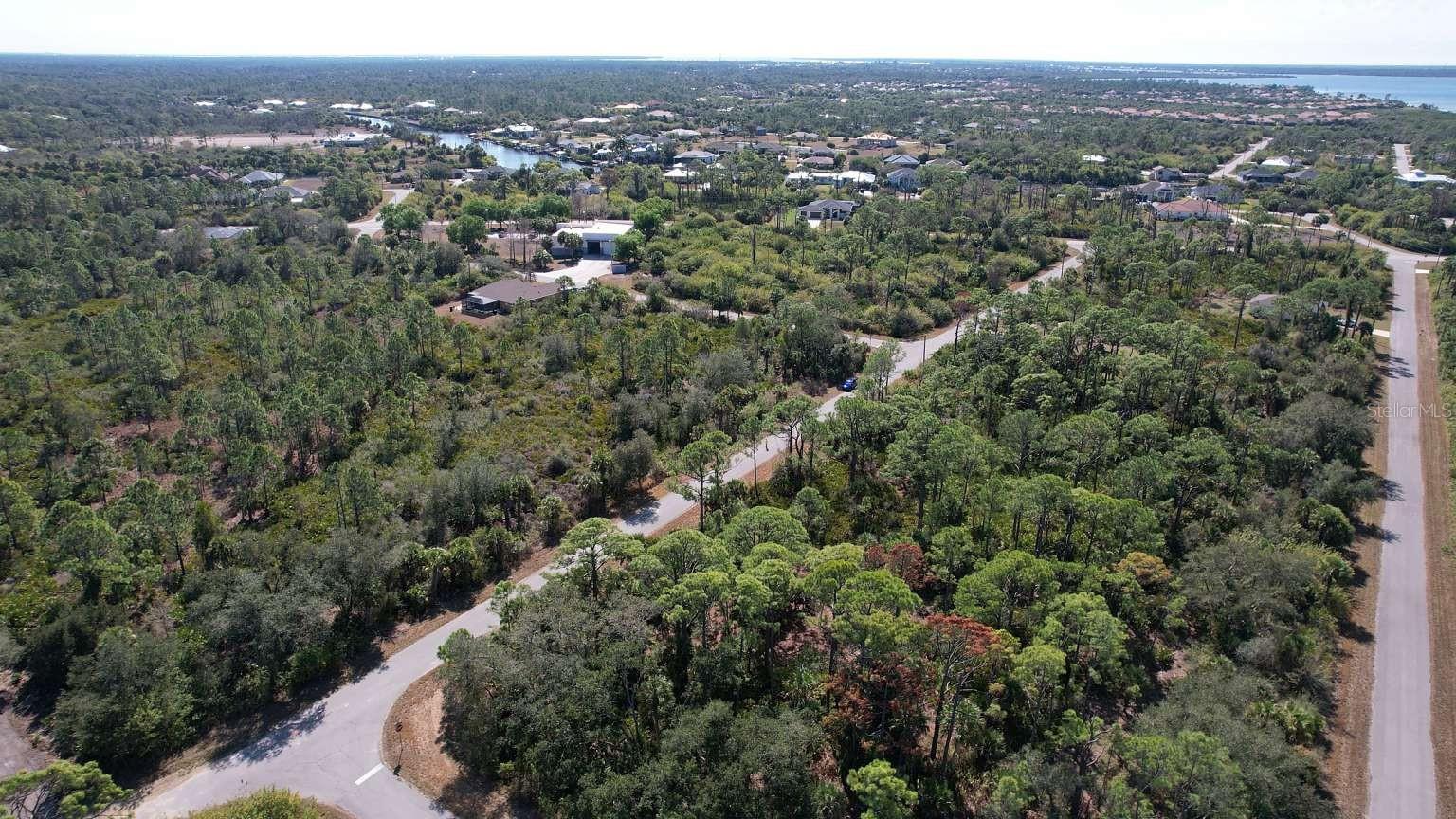 Aerial view of surrounding area; nearby water is not part of the property.