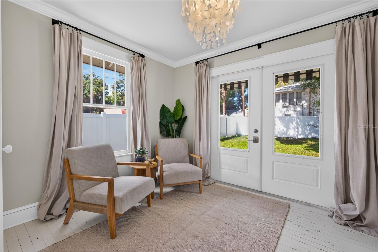 flex bedroom / office with doors to backyard