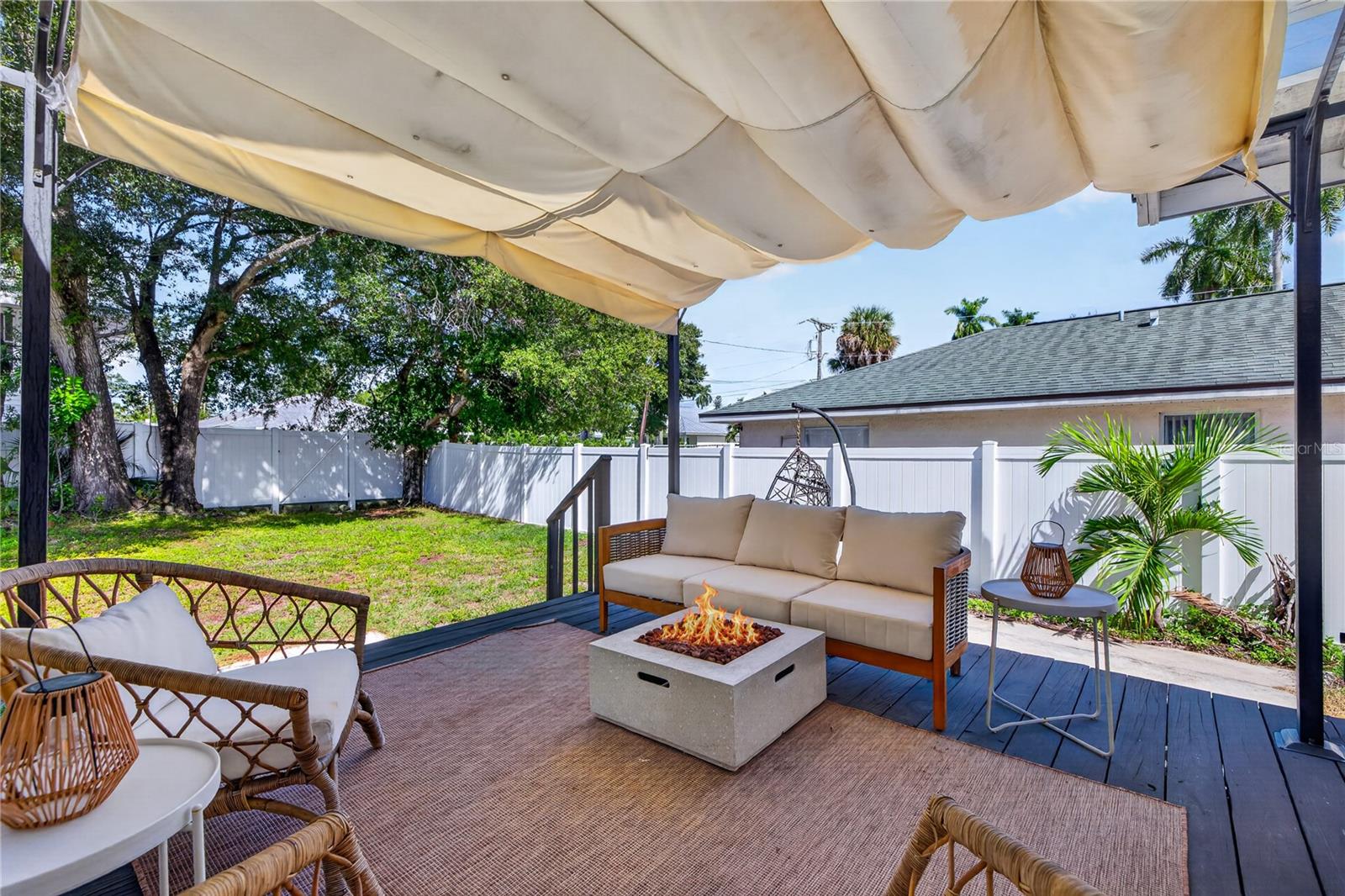Back porch with newly fenced in backyard