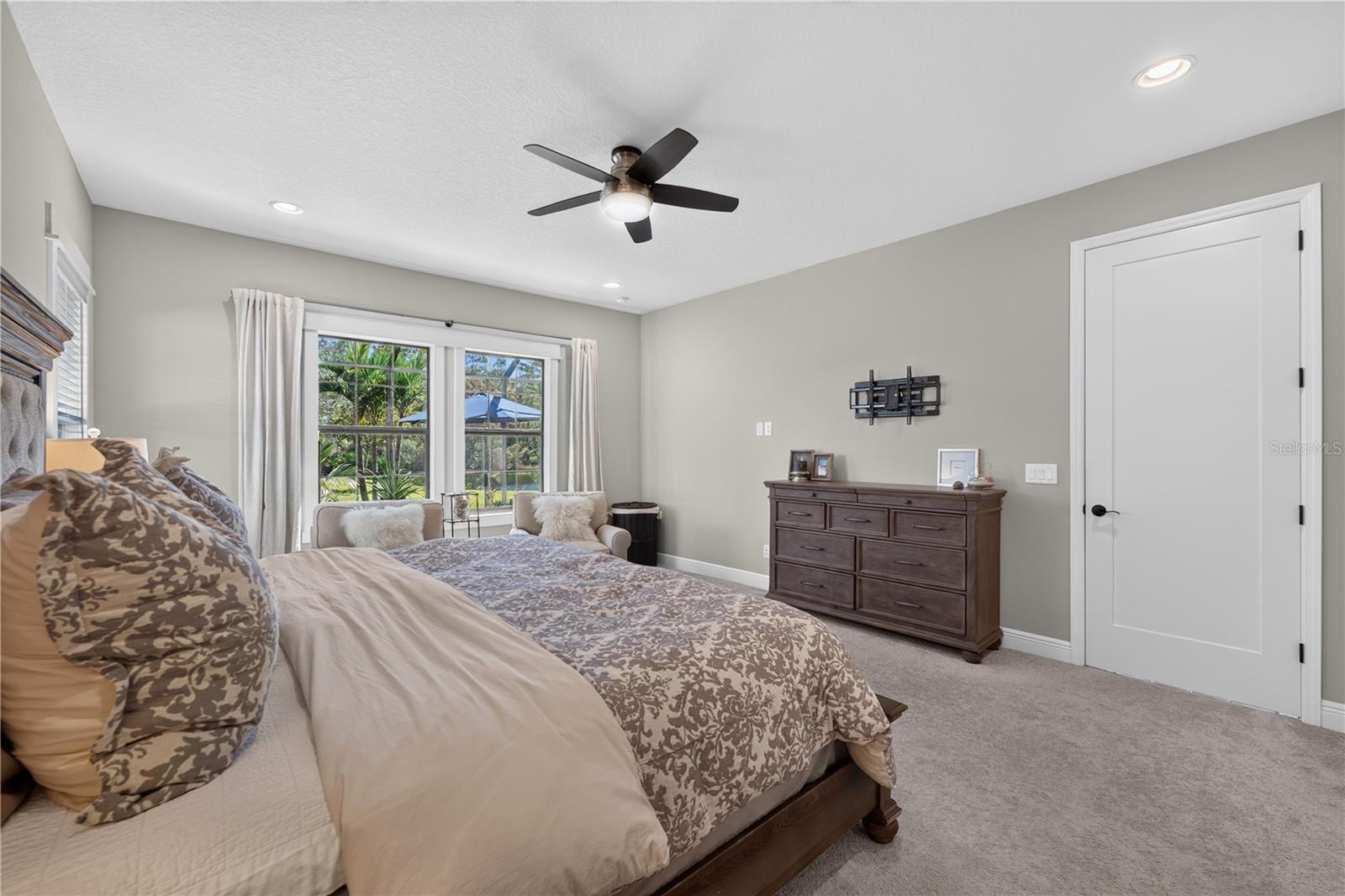 Primary Suite with views of the pool and conservation.