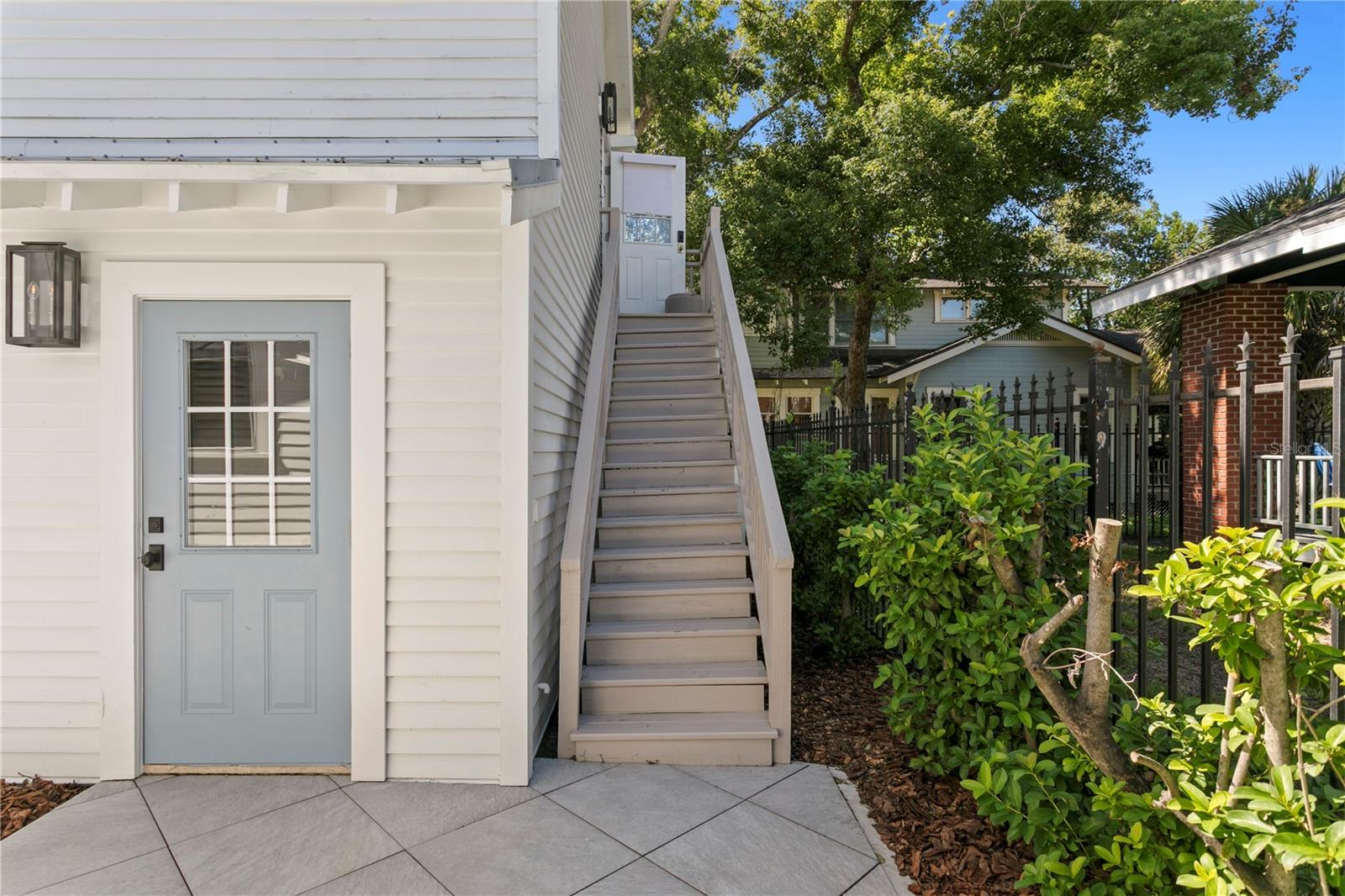Door to the 2 car garage, Stairs lead to the Guest House