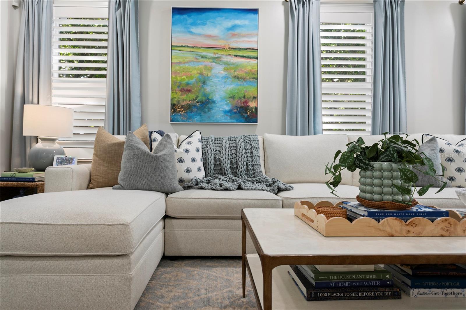 Layered window treatments with shutters and drapery Layered window treatments with shutters and drapery