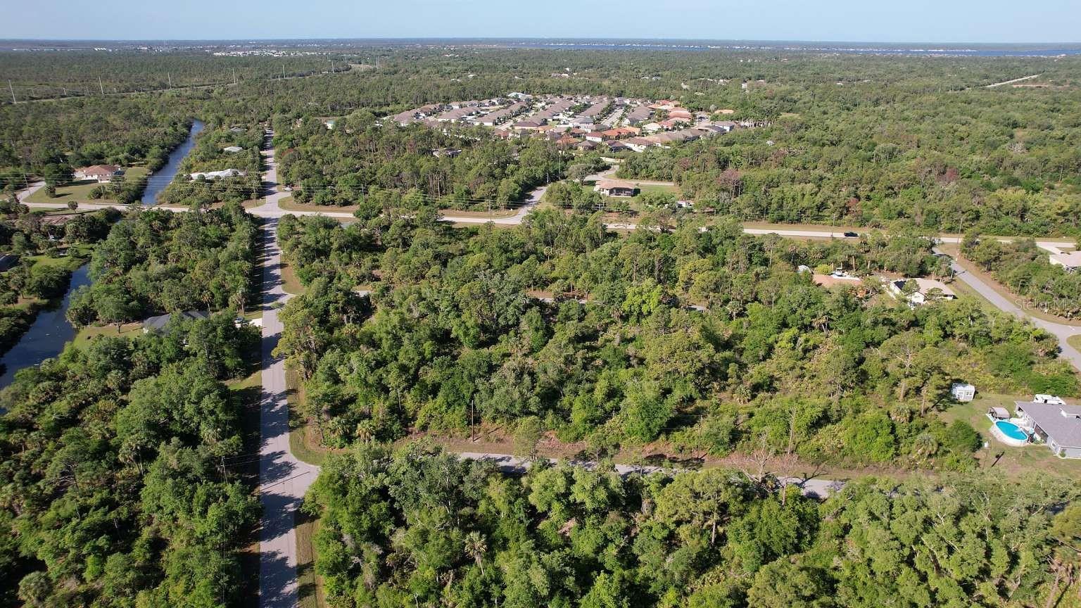Aerial view of the surrounding area; nearby water features are not part of this property and do not establish access rights.