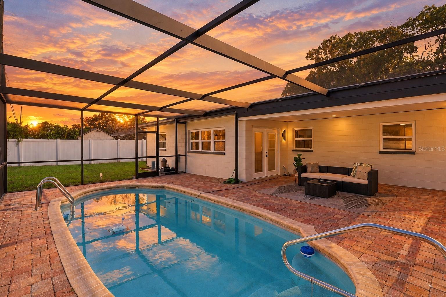 Enjoy beautiful Florida sunsets from your private screened-in pool and spacious paver patio, the perfect setting for relaxing, entertaining, and enjoying outdoor living year-round. Enjoy beautiful Florida sunsets from your private screened-in pool and spacious paver patio, the perfect setting for relaxing, entertaining, and enjoying outdoor living year-round.