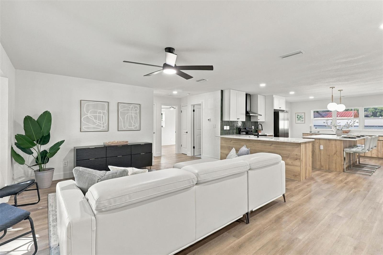 Step inside to a welcoming living room that flows seamlessly into the beautifully updated kitchen, creating an inviting and functional space perfect for everyday living and entertaining. Step inside to a welcoming living room that flows seamlessly into the beautifully updated kitchen, creating an inviting and functional space perfect for everyday living and entertaining.