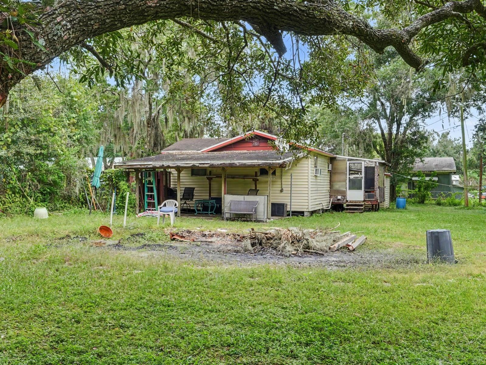 Tree-Shaded Property with Fire Pit & Covered Patio Entertaining Space