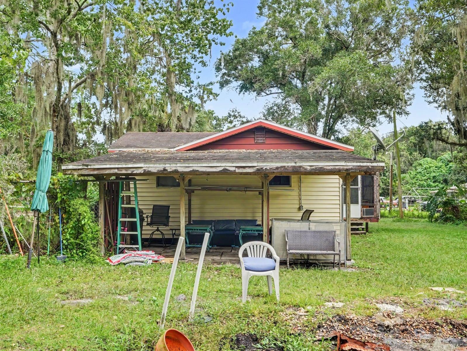 Home Set Among Mature Oak Trees with Front Covered Carport