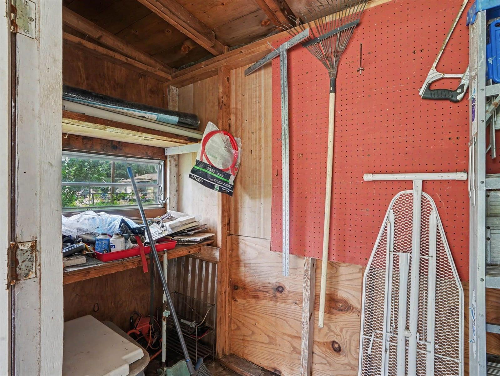 Workshop Storage with Pegboard Organization & Window View