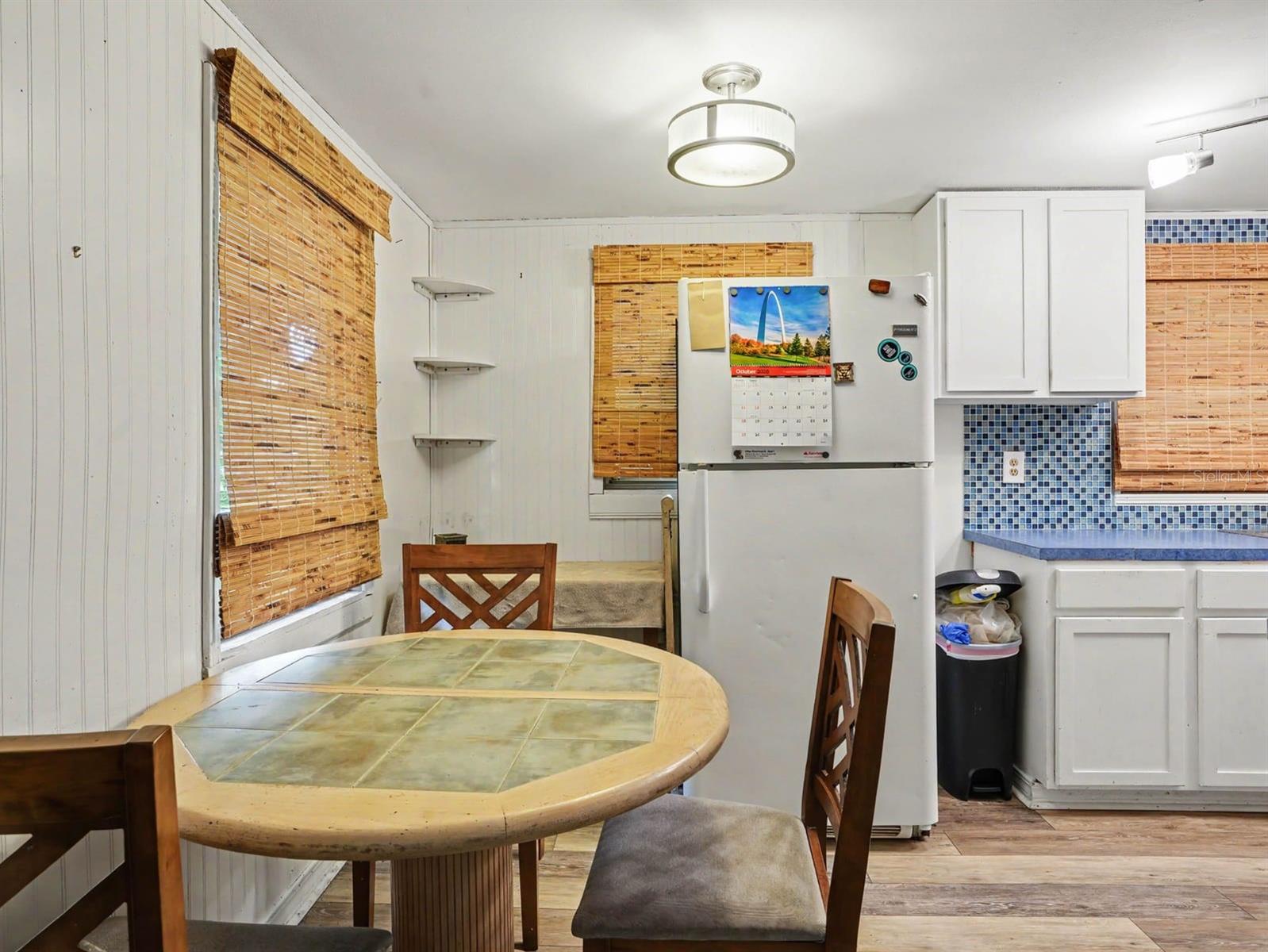 Kitchen Features Blue Tile Backsplash & Updated Appliances
