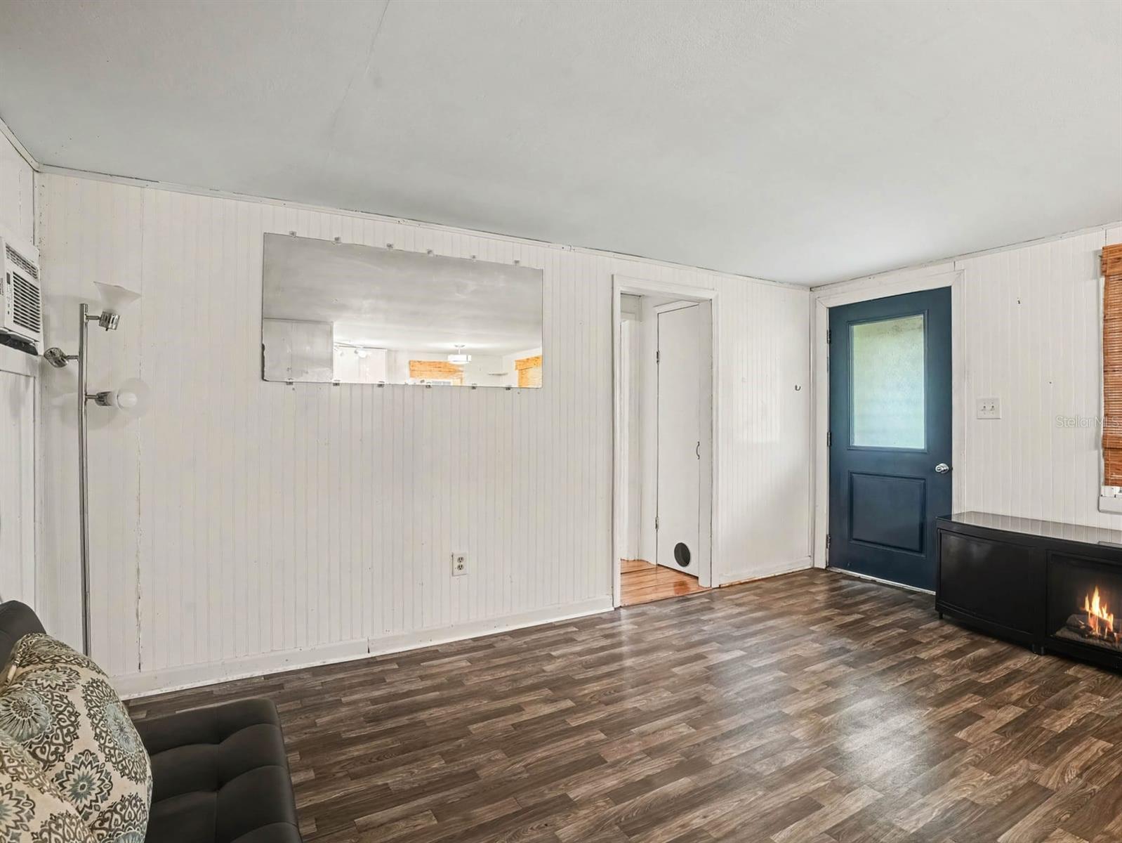 Open Living Area with Fireplace & Modern Flooring