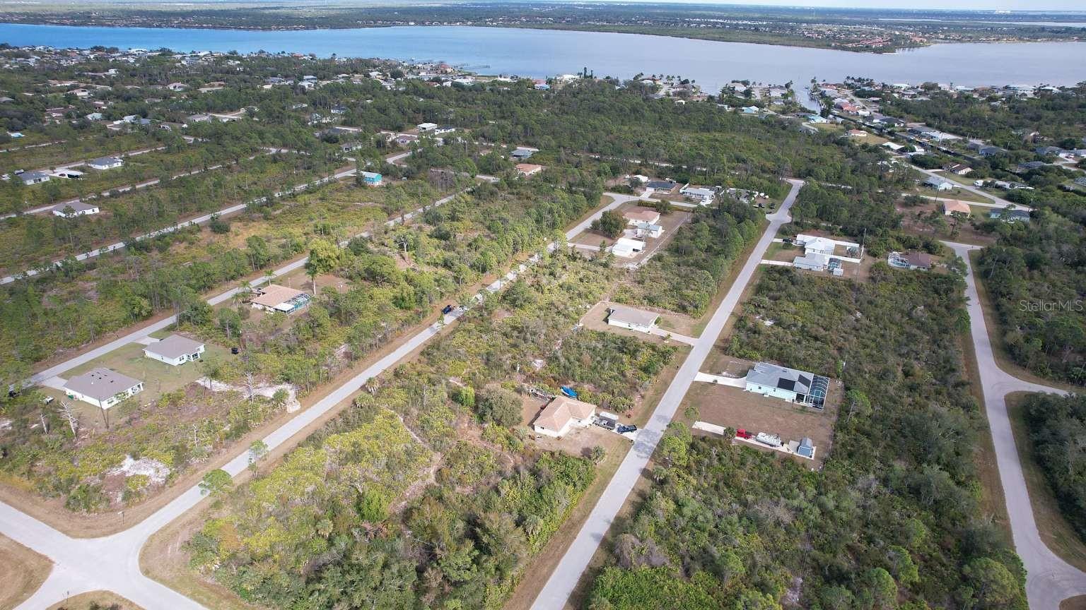 Aerial view of the surrounding area; nearby water features are not part of this property and do not establish access rights.