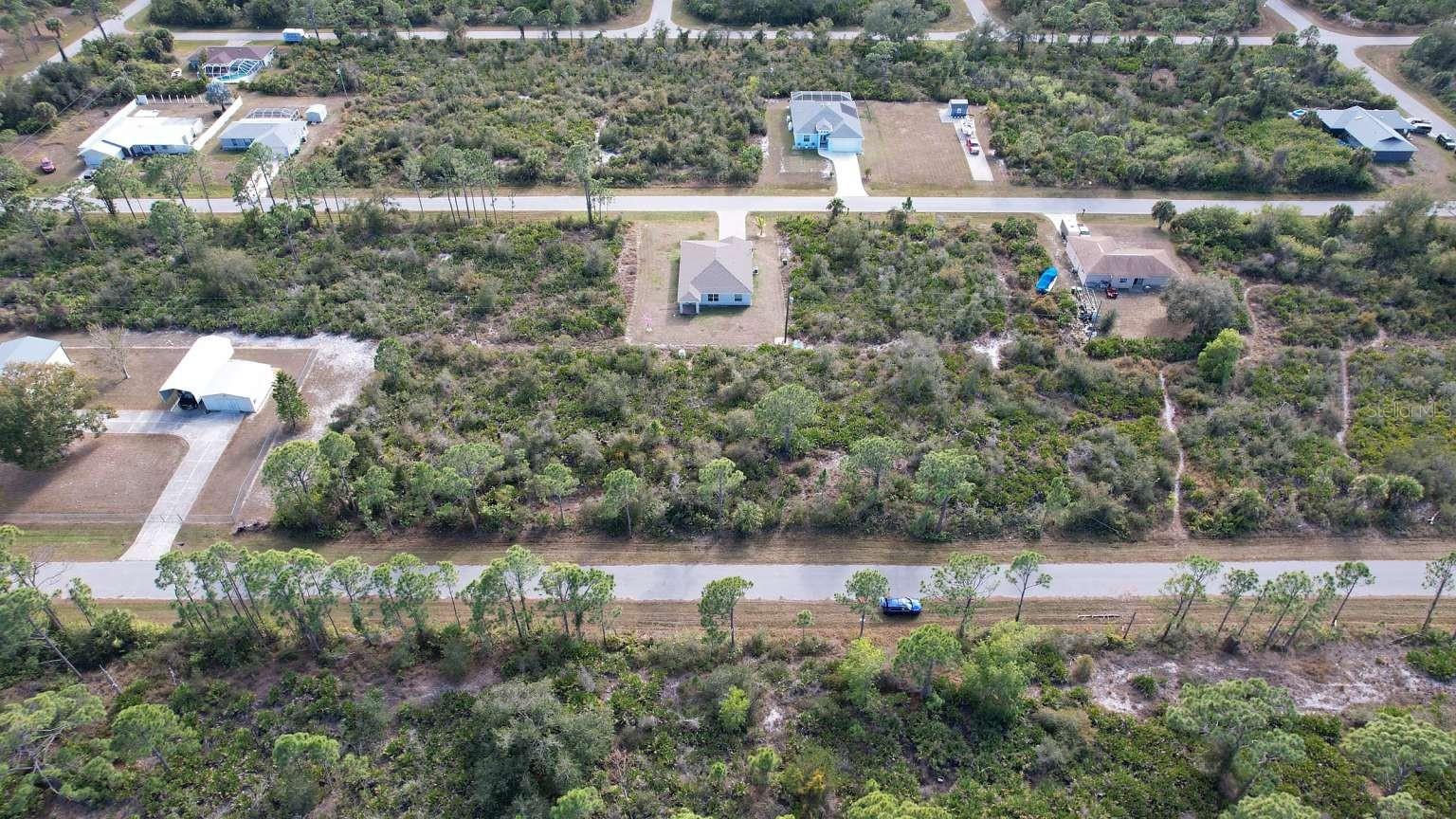 Aerial view of the lot and surrounding neighborhood; neighboring improvements are not included.