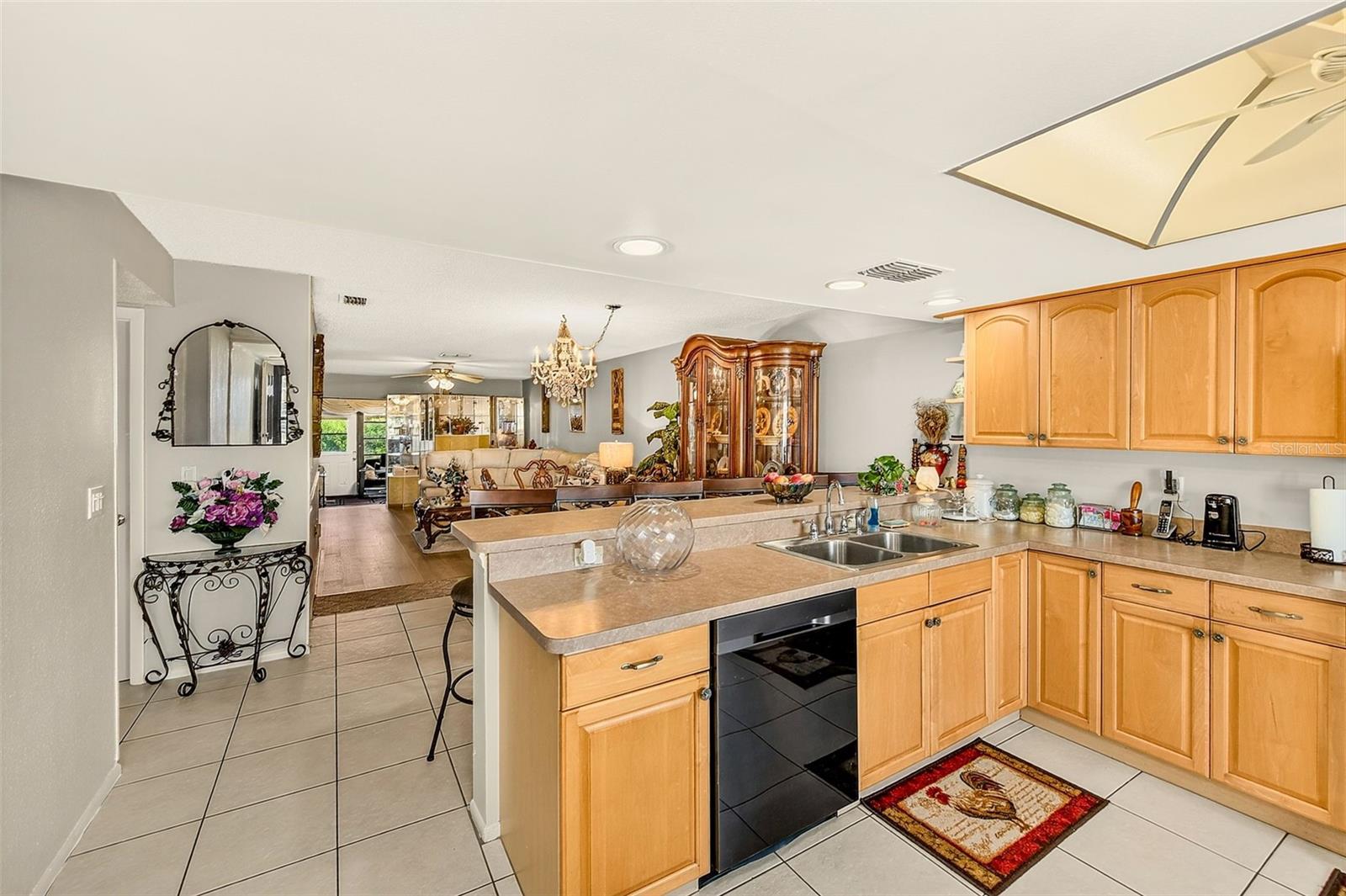 view of kitchen to back of condominium