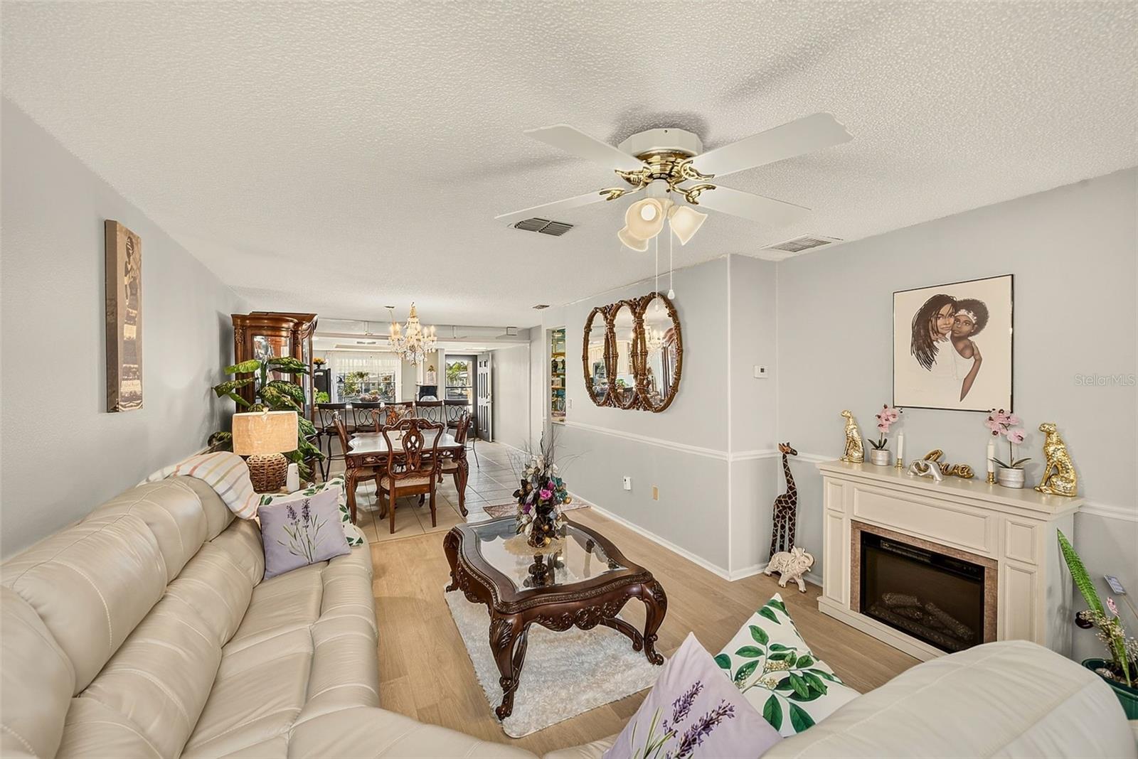 View of living room, dining room and kitchen