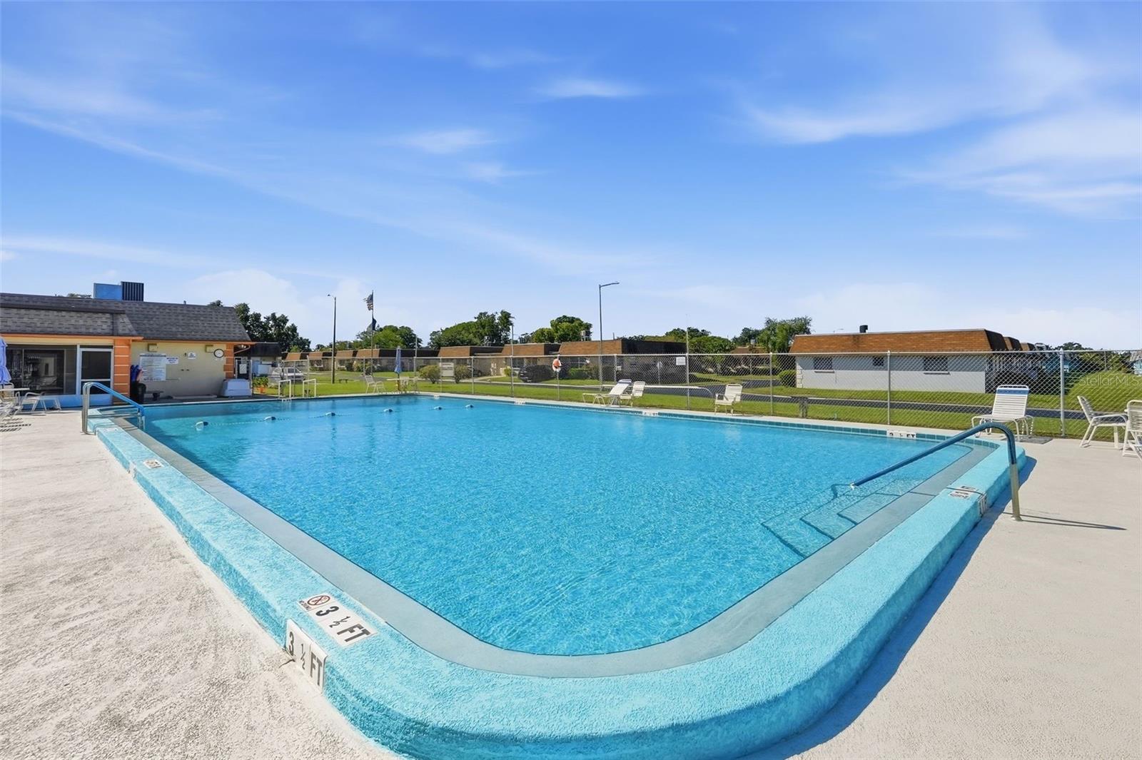 Enjoy the Florida sunshine at the community swimming pool.
