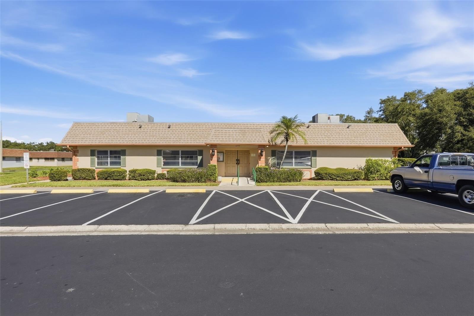 Vendome Village community clubhouse and parking area.