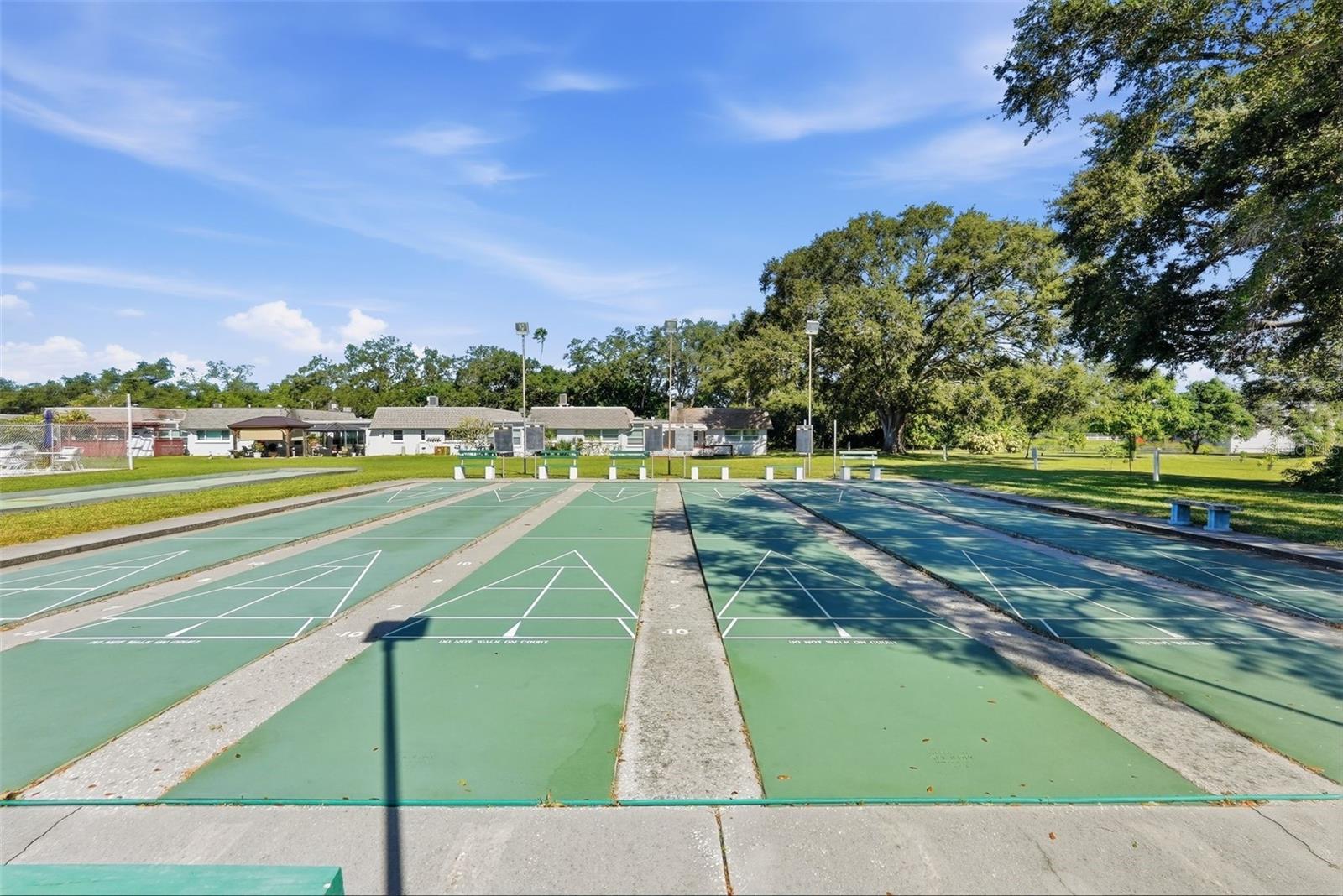 Community shuffleboard courts provide additional recreational opportunities.