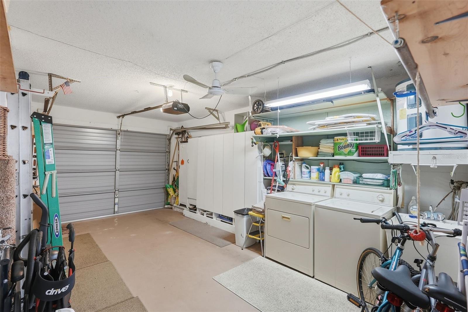 Additional garage view showing room for storage and household essentials.