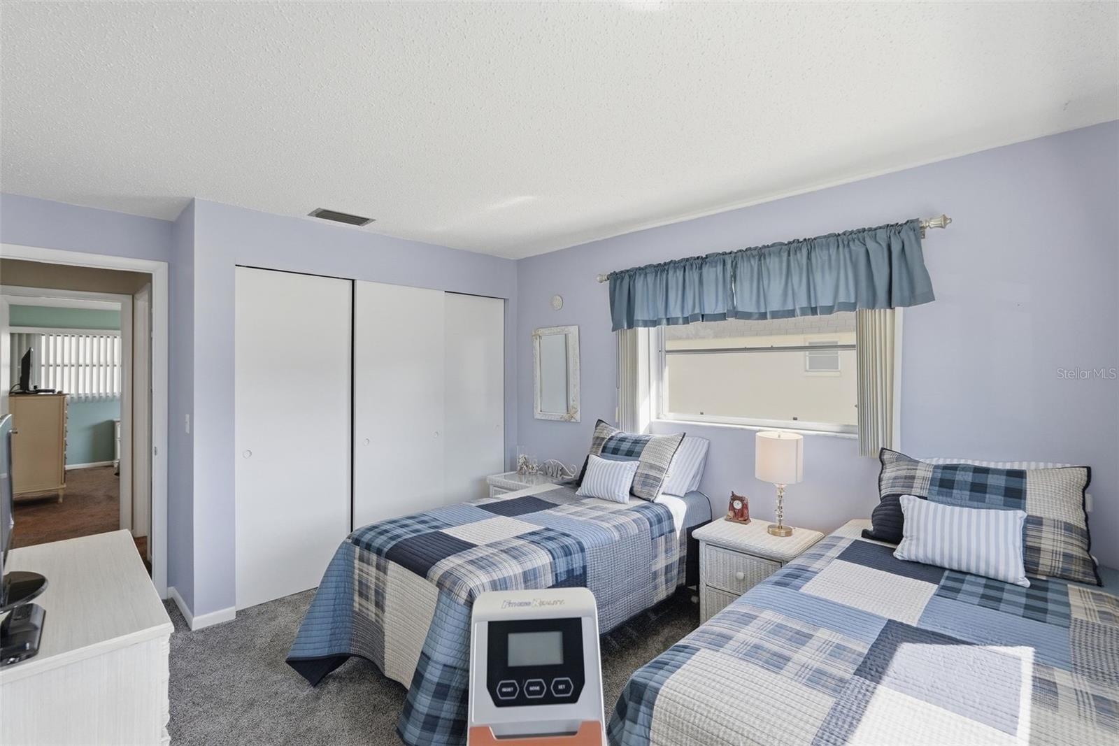 Additional view of Bedroom 2 with closet space and two windows. Additional view of Bedroom 2 with closet space and two windows.