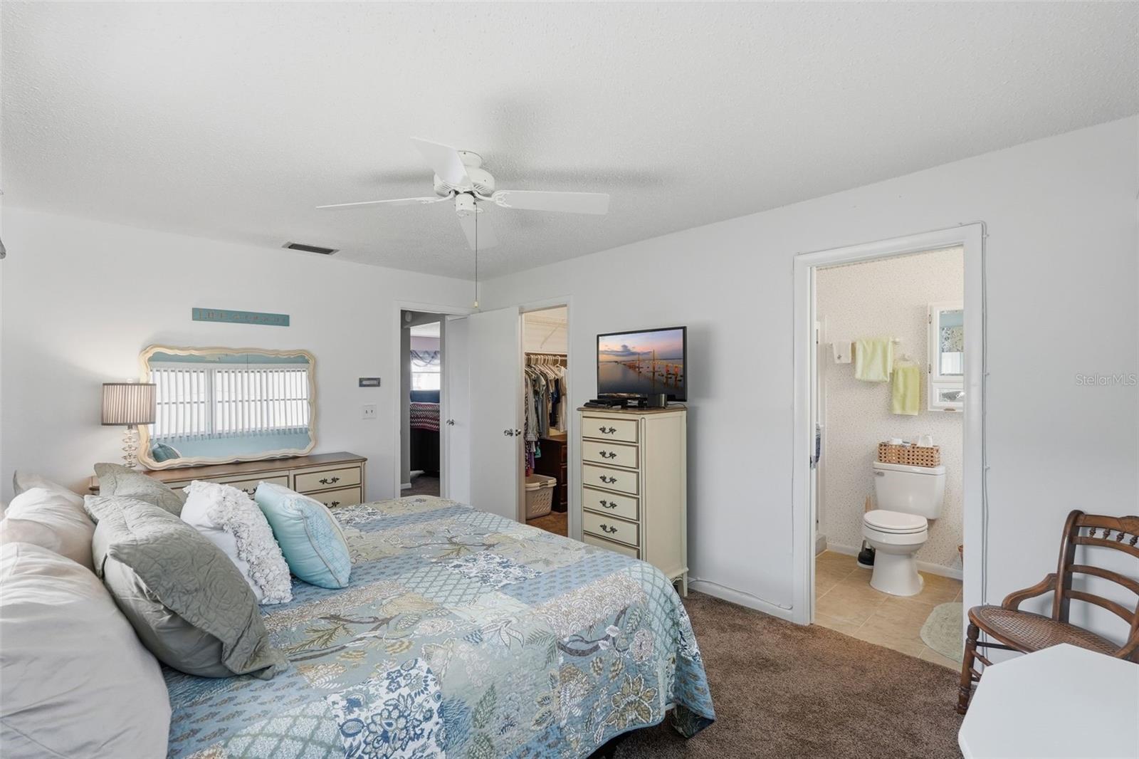 Another view of the primary bedroom and its spacious layout.