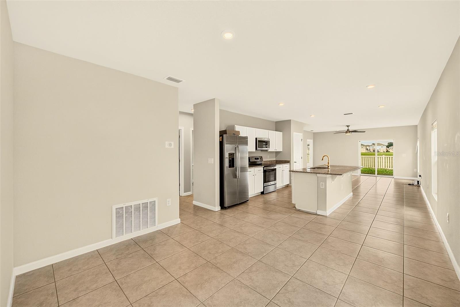 DINING TO KITCHEN TO GREAT ROOM