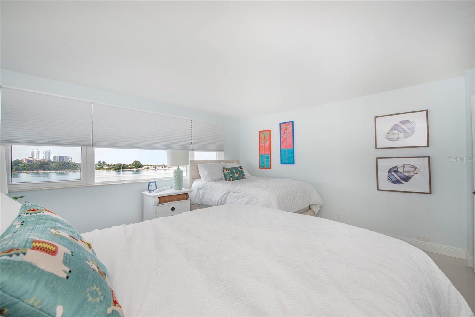 Bedroom II have two full beds and VIEWS along one whole side as well as large closet