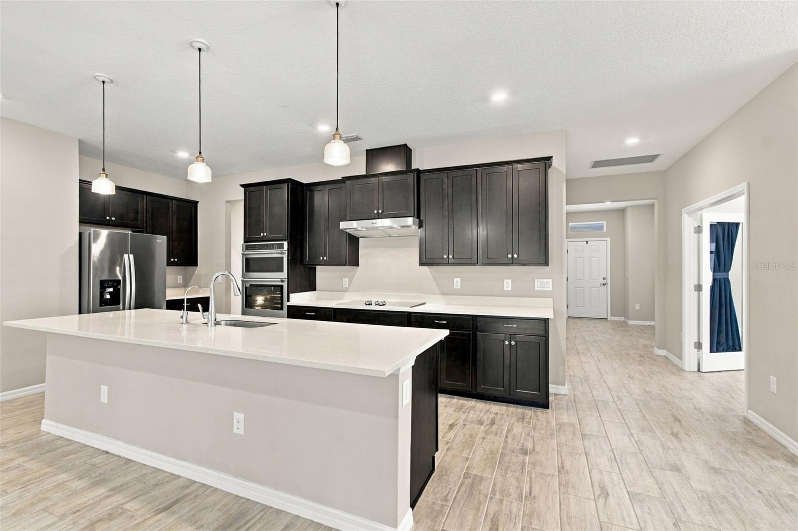 Kitchen with front door in the background