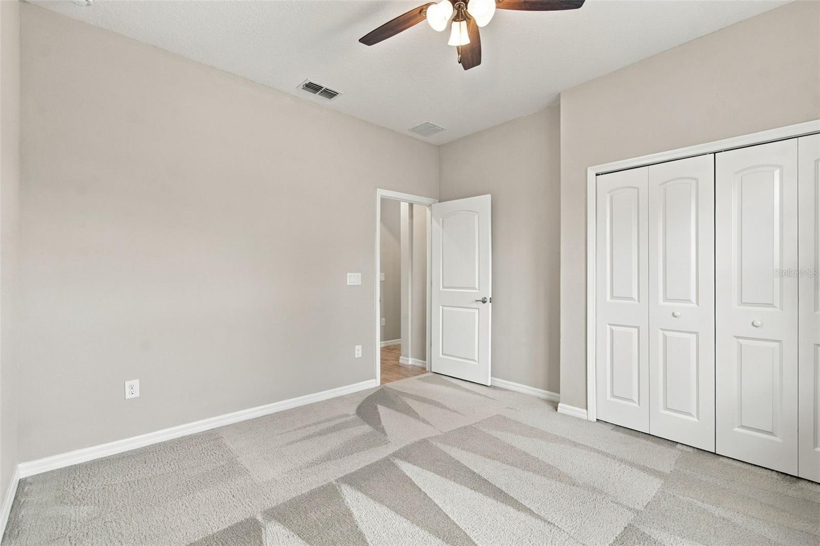 Guest bedroom with ceiling fan