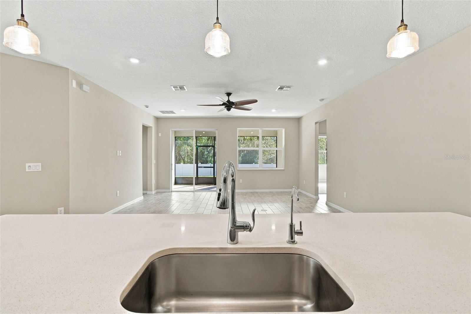 View from kitchen island - deep stainless steel sink has a dedicated Reverse Osmosis drinking water tap!