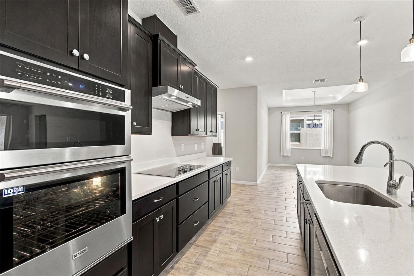 Wall oven with convection air frying features and built in microwave