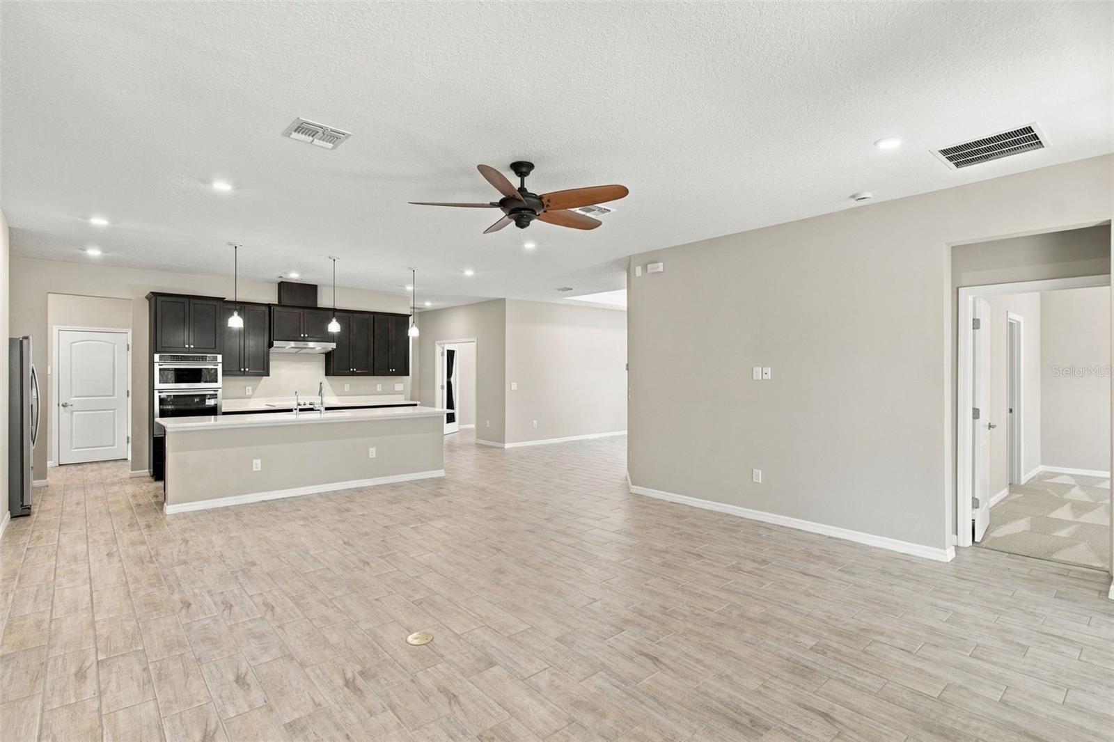 Exiting the Primary Suite into the Living Room