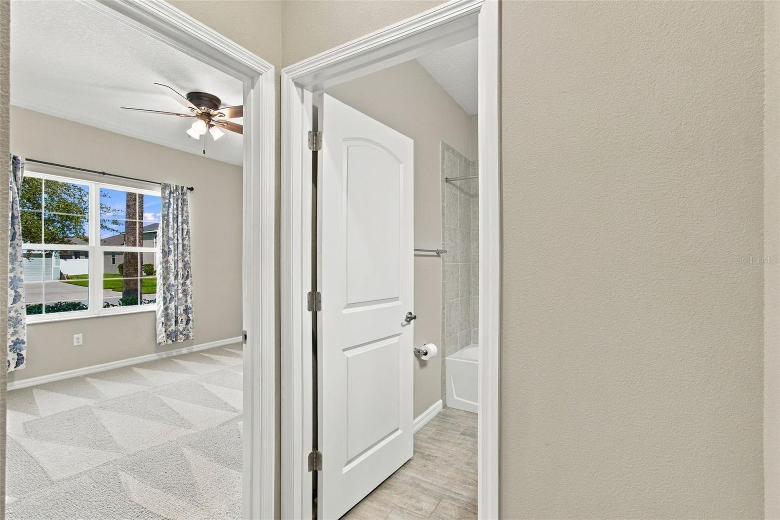 Guest bedroom to the left and full bathroom to the right