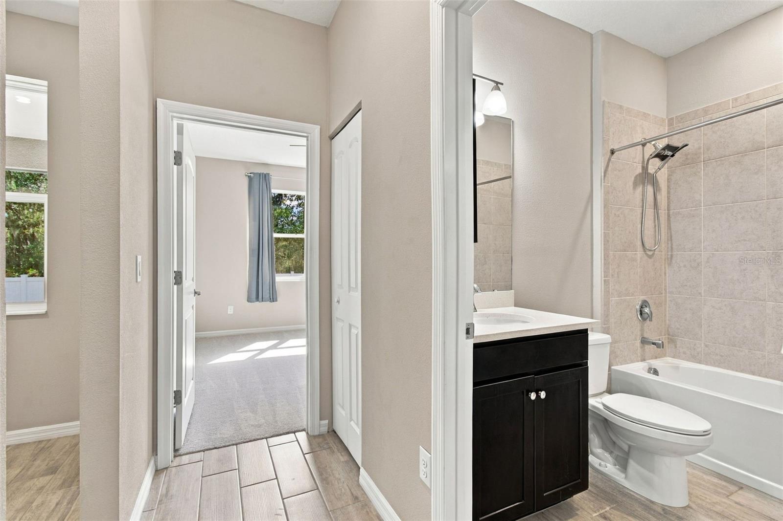 Bedroom to the left, shared bathroom to the right