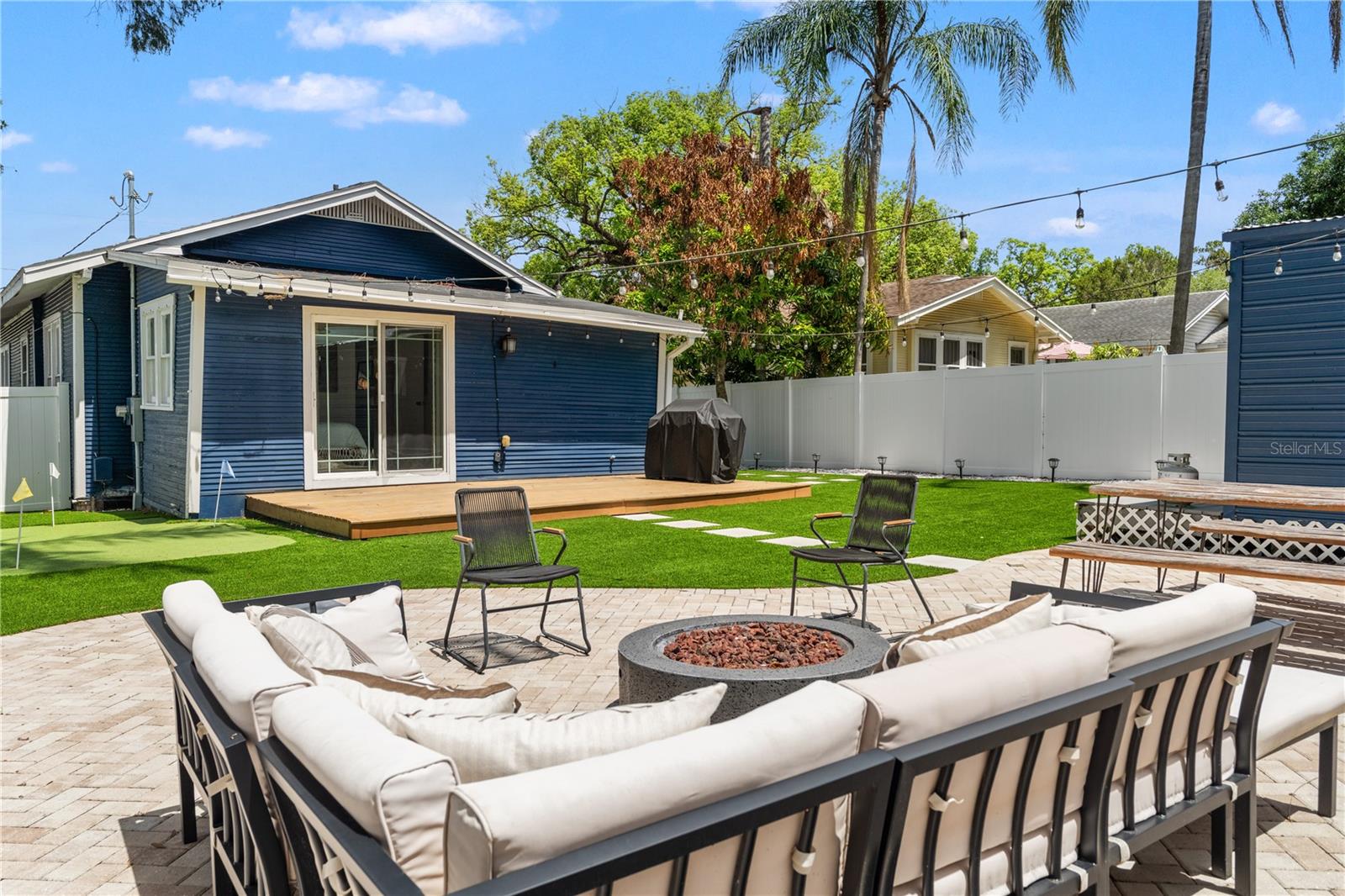 Backyard with fire pit & turf