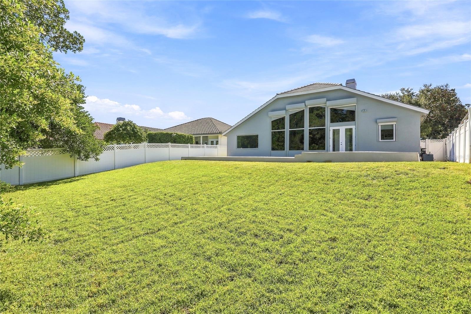 Impressive lawn of this fenced property.
