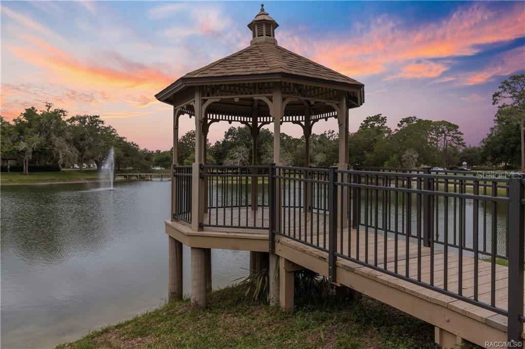 GAZEBOYOUR OWN LITTLE SLICE OF PARADISE! Unwind at Meadowcrest's charming POND GAZEBO overlooking a peaceful pond w/fountain. A picturesque setting to enjoy nature, relax & take in the beautiful Florida sunsets!