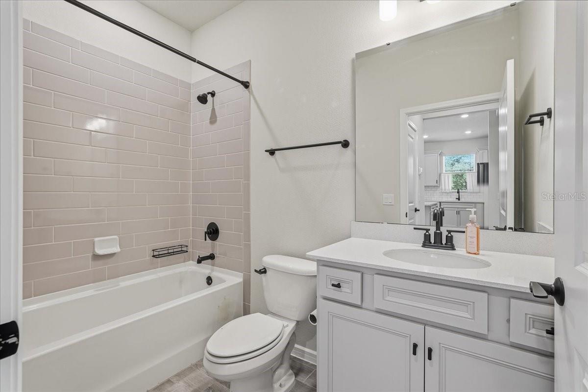 Guest Bath with Tub/Shower Combination and Tile Surround