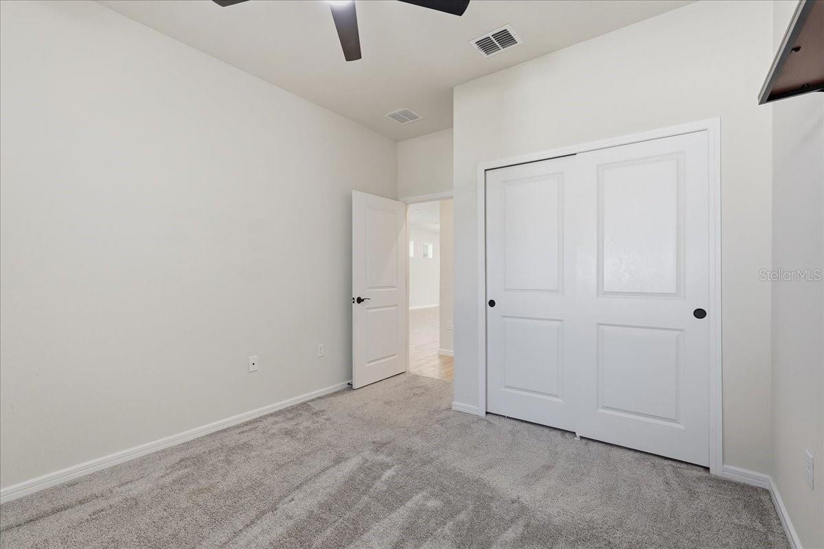 Bedroom 3 with Lighted Ceiling Fan