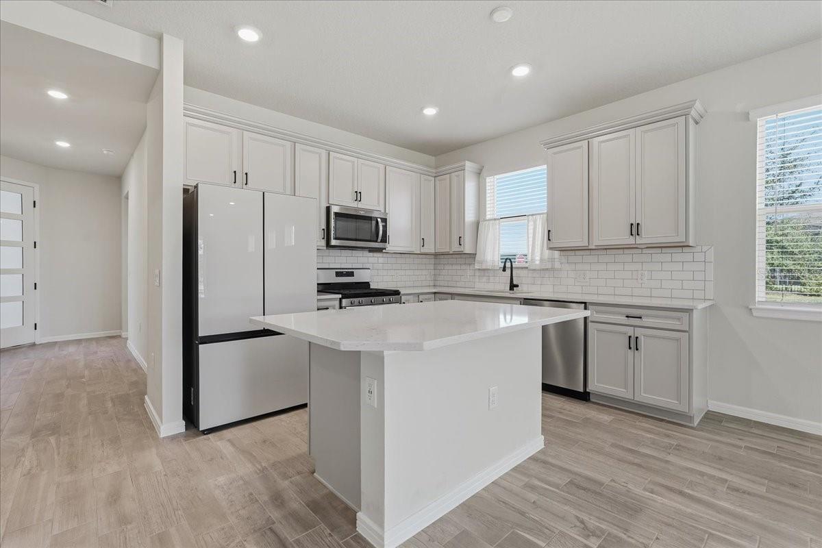 Kitchen with Quartz Countertops and Subway Tile Backsplash Kitchen with Quartz Countertops and Subway Tile Backsplash